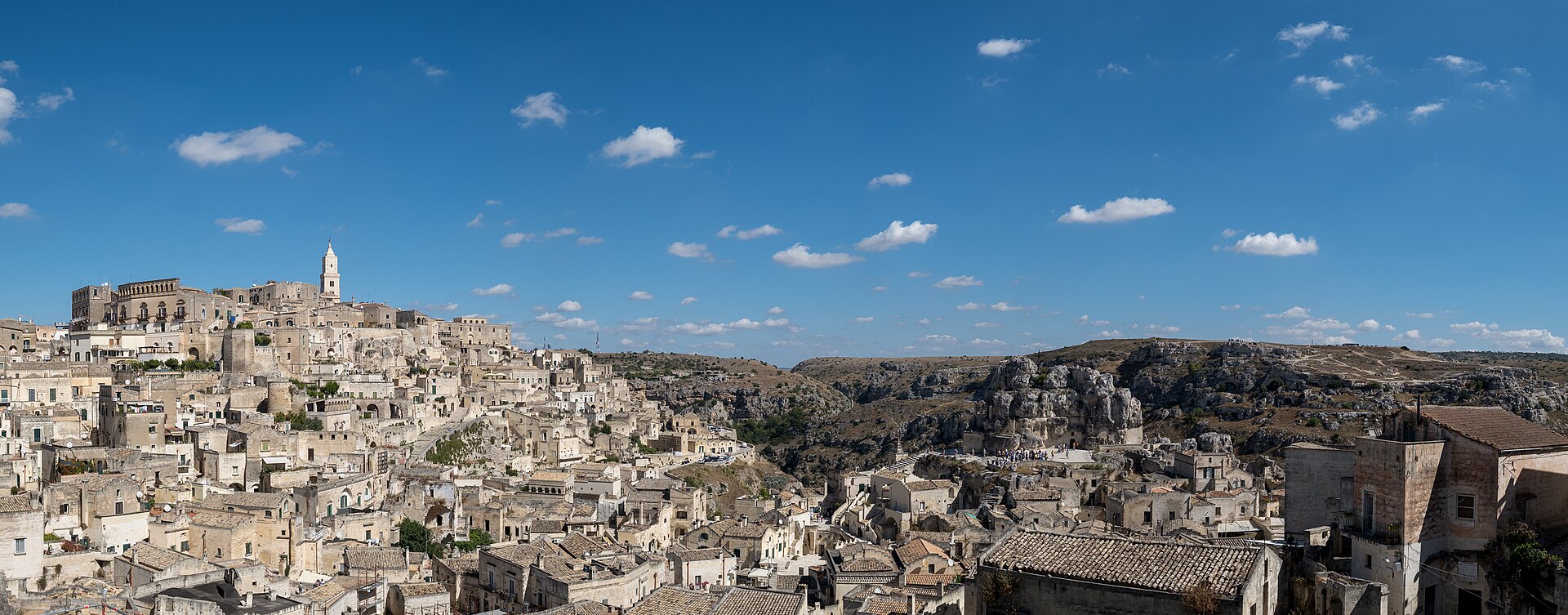 The cave dwellings of Matera's Sassi at dusk, an affordable place in Italy that looks far more expensive than it is