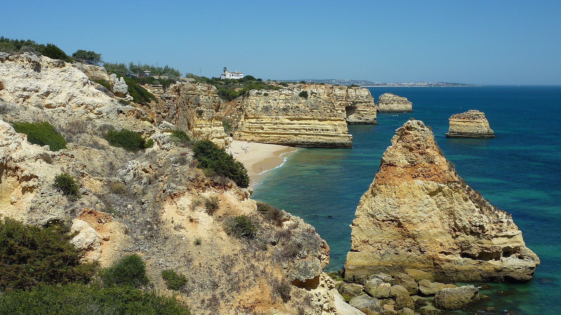 Marina di Praia at Praiano, a compact pebble cove framed by cliffs and a medieval watchtower