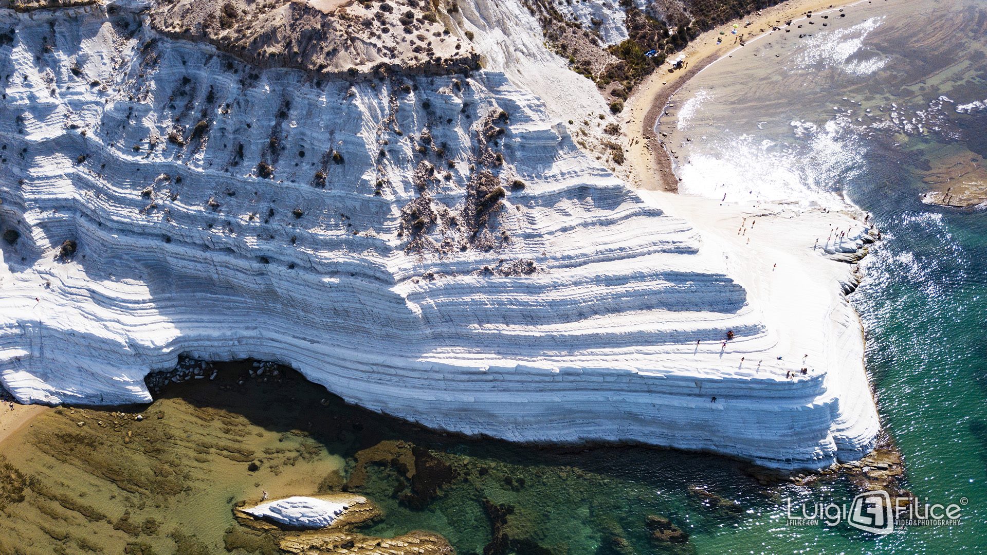The white marl cliffs of Scala dei Turchi above turquoise water, among the best beaches in Sicily for scenery