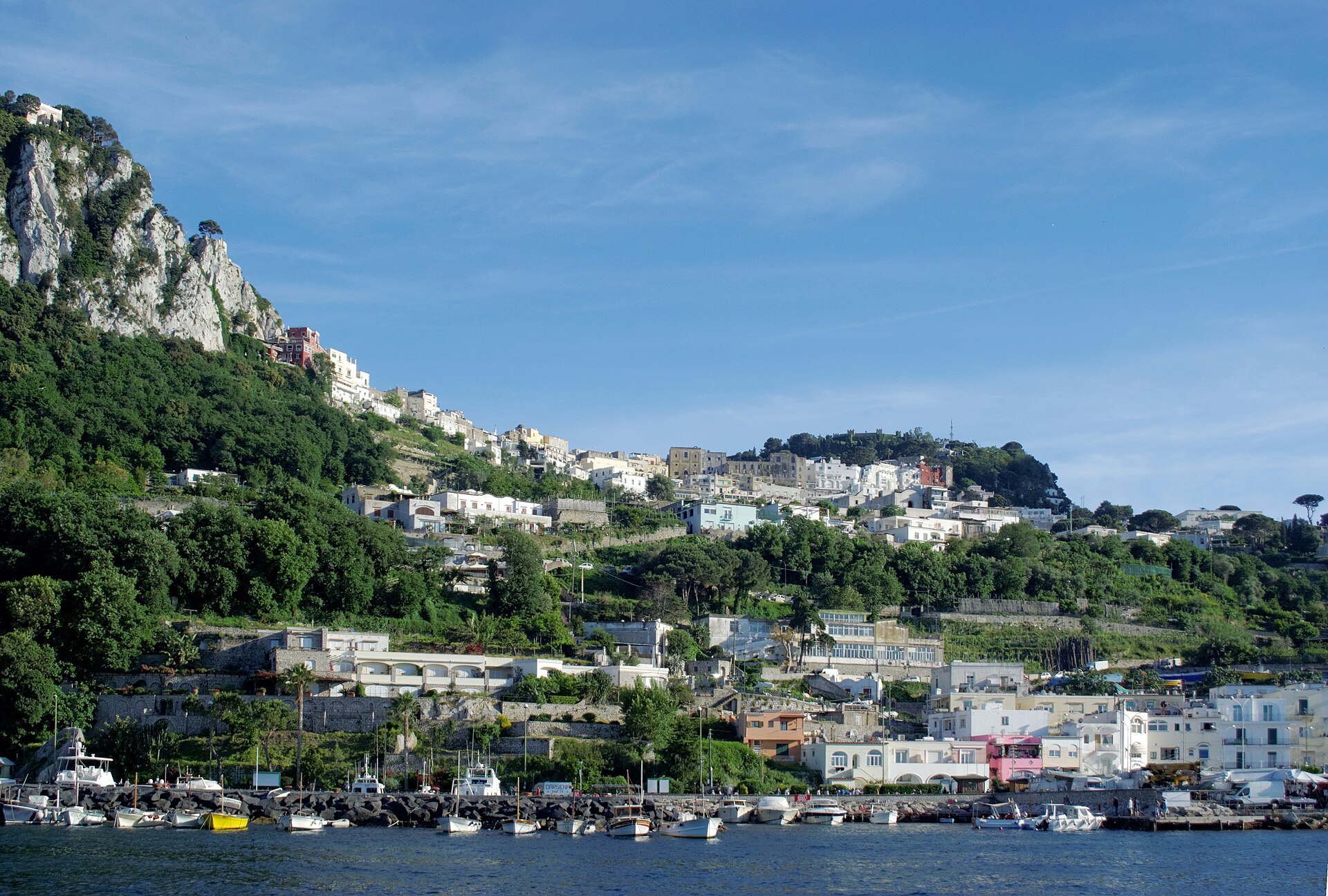 Capri day trip starts at Marina Grande, the island's main harbour, ringed by coloured buildings and bobbing ferries