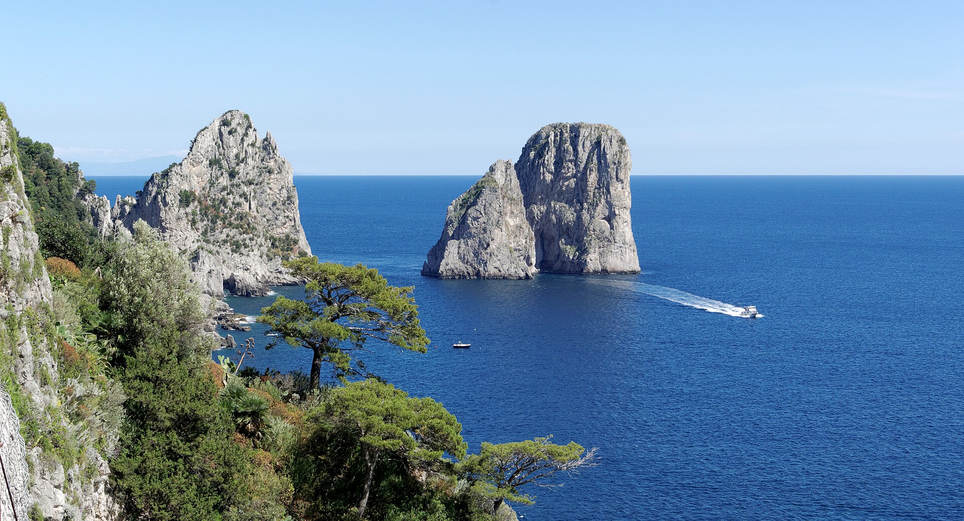 The Faraglioni — Capri's three limestone sea stacks, best seen from a small boat at water level