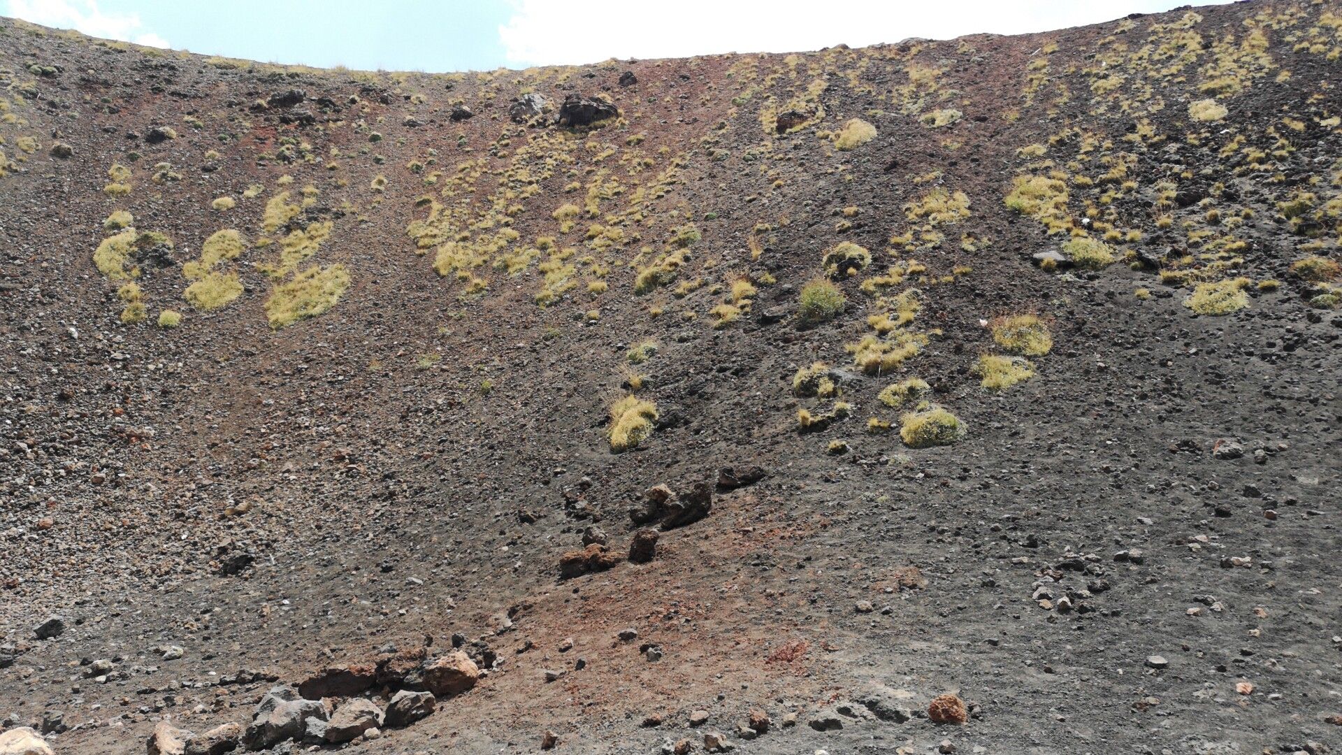 Hikers at the Silvestri craters on the lower slopes of Mount Etna near Catania