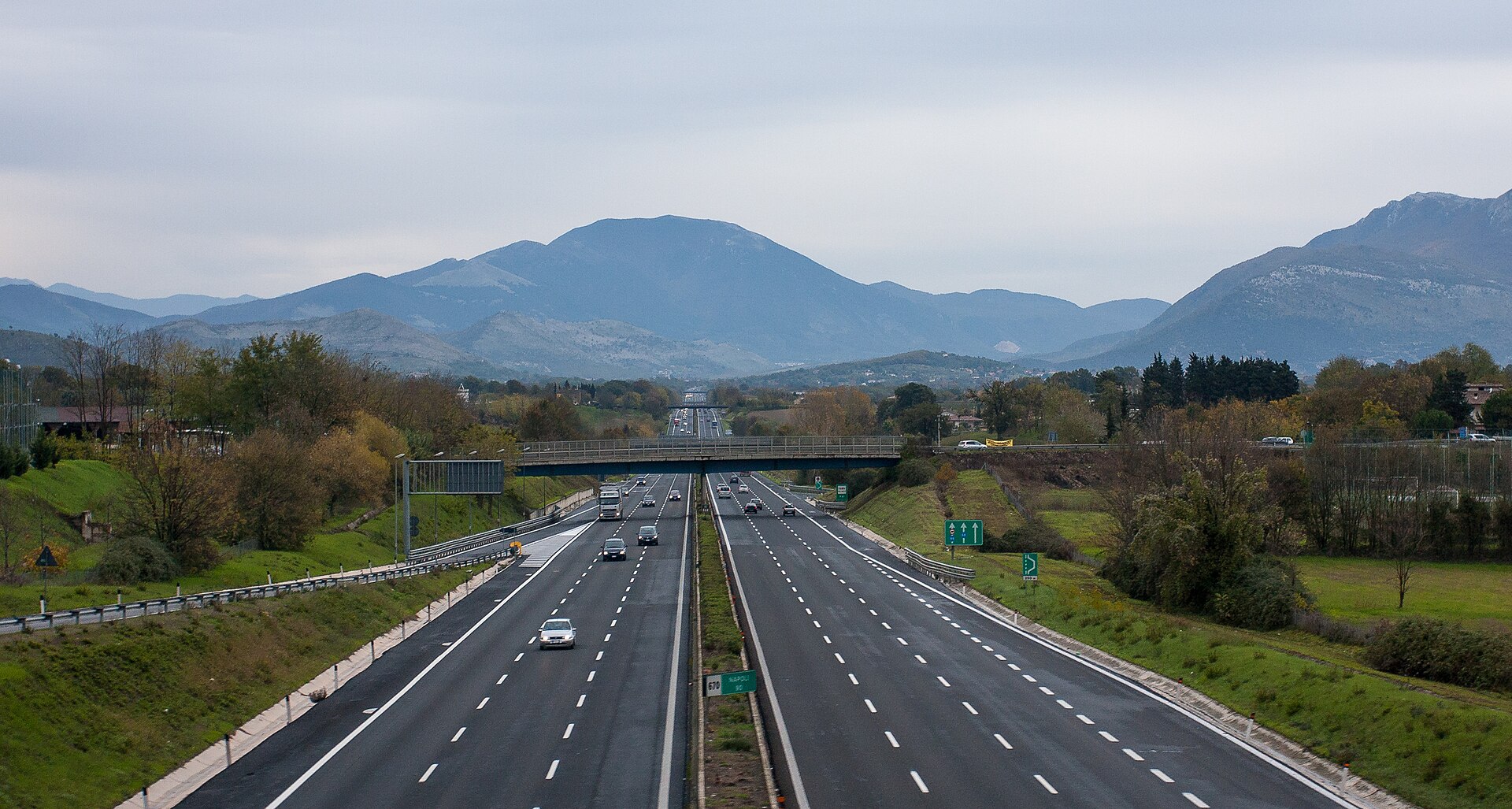 An Italian autostrada toll booth showing the lane markings for Telepass, card, and cash payment