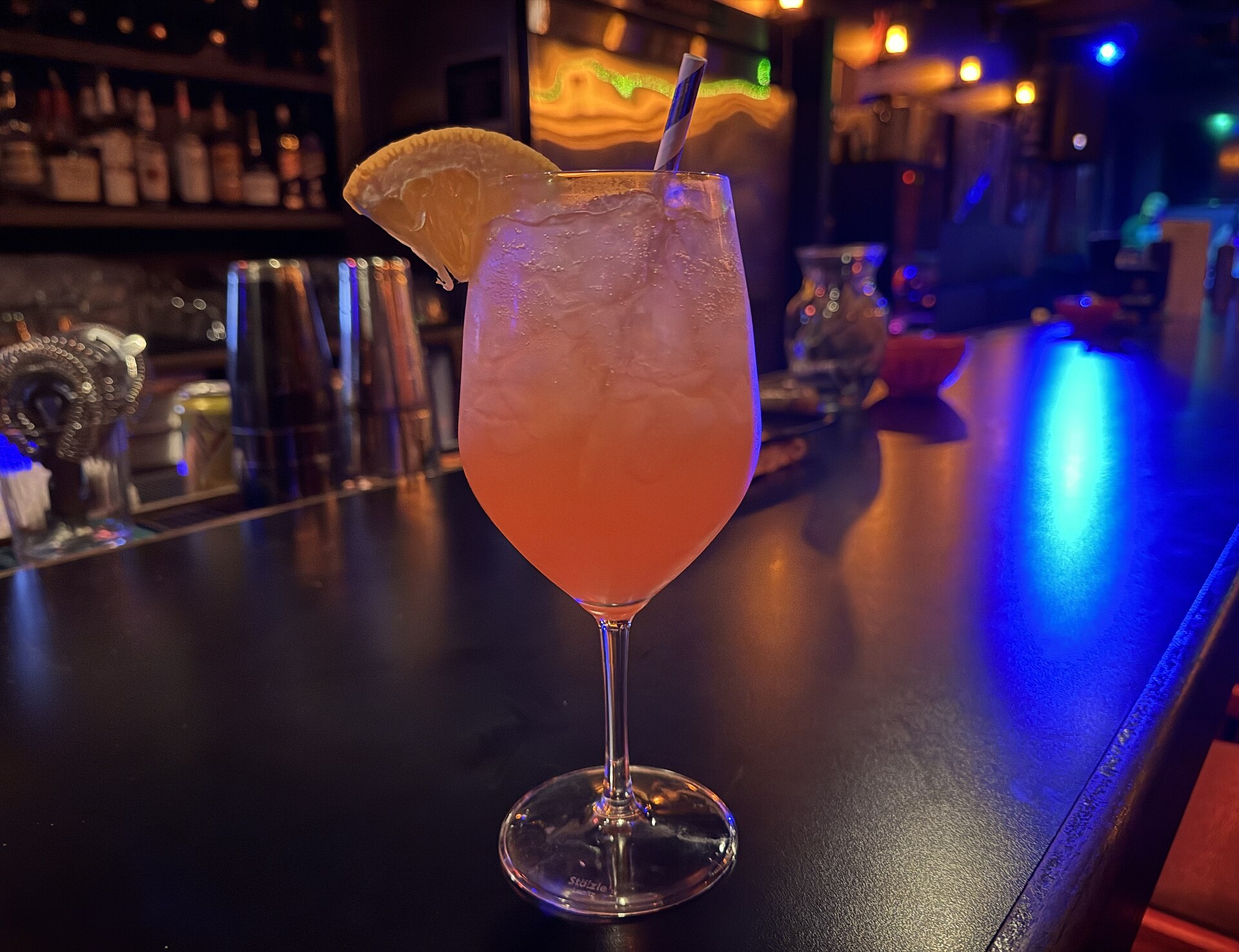 A bright orange Aperol Spritz with an orange slice, the signature drink of aperitivo Italy