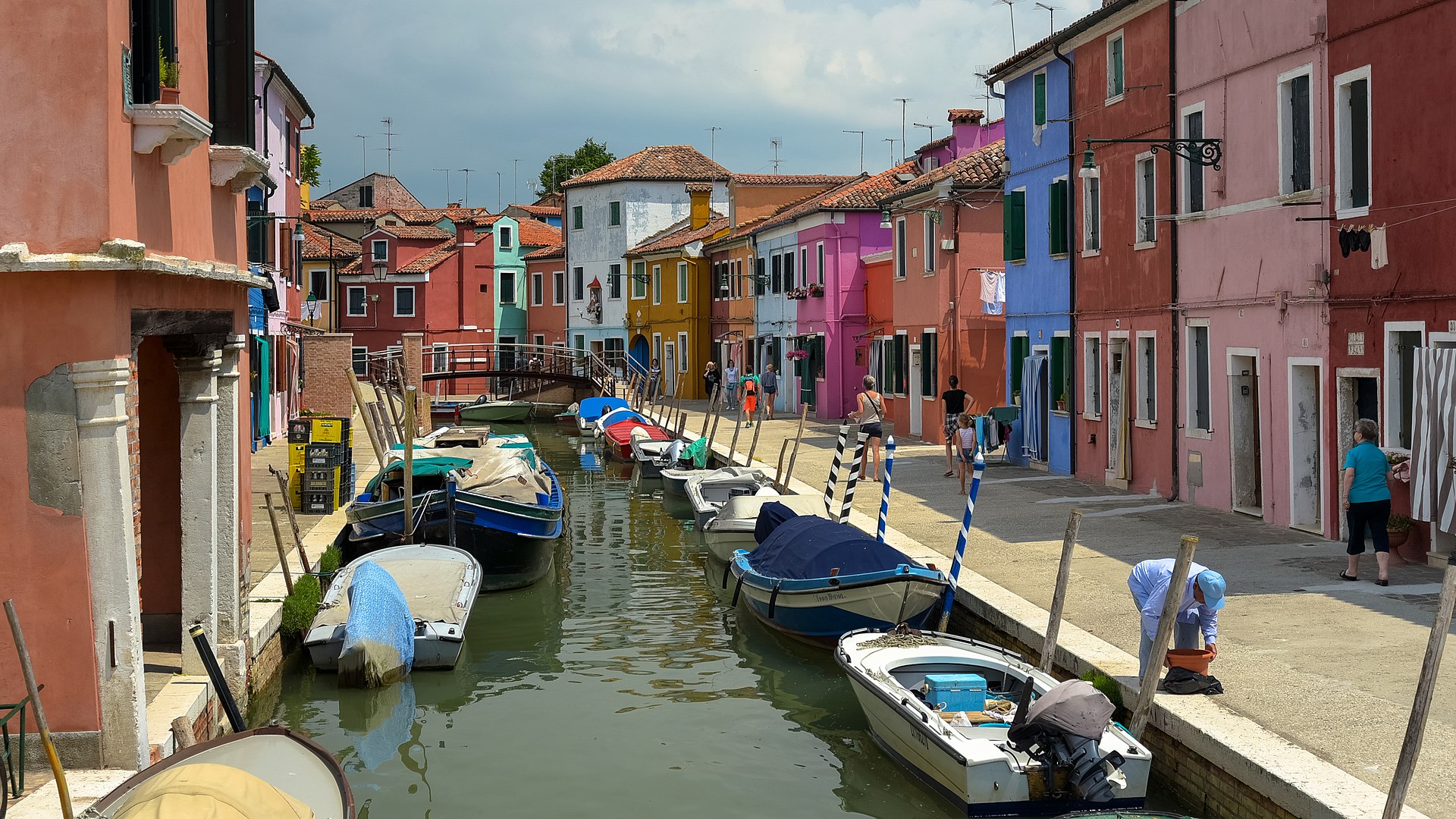 A Murano Burano day trip starts with the riot of color that is Burano's famous painted houses along the canal