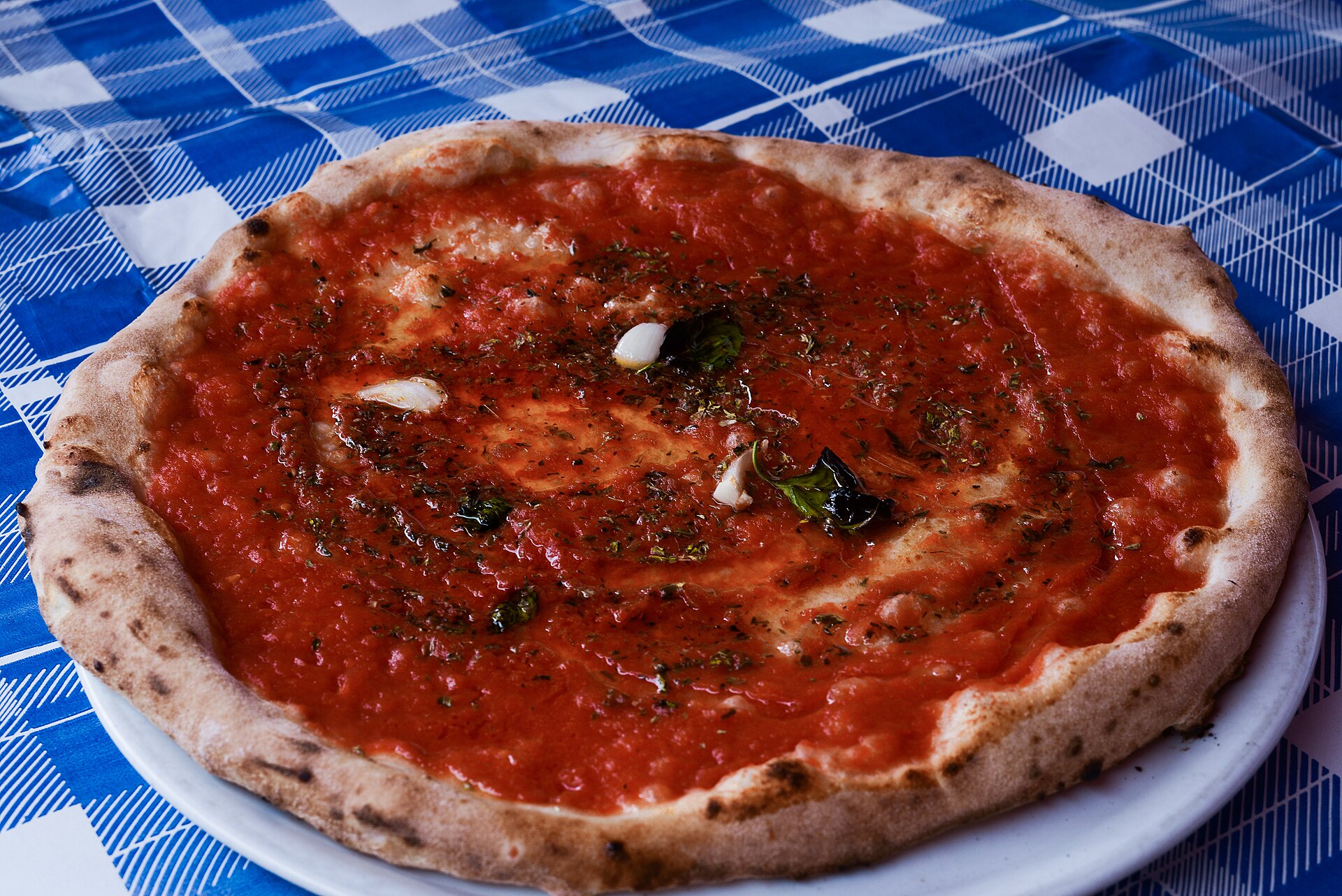 A classic Neapolitan marinara pizza with tomato, garlic and oregano and no cheese