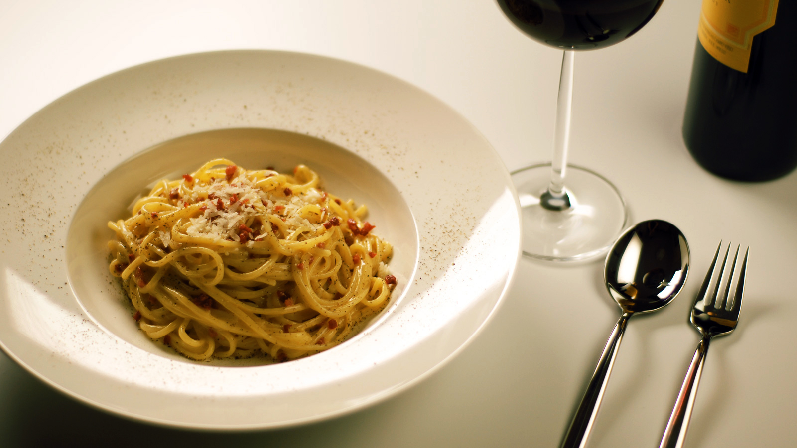 Spaghetti alla carbonara with guanciale and pecorino, one of the best Roman dishes to order at dinner