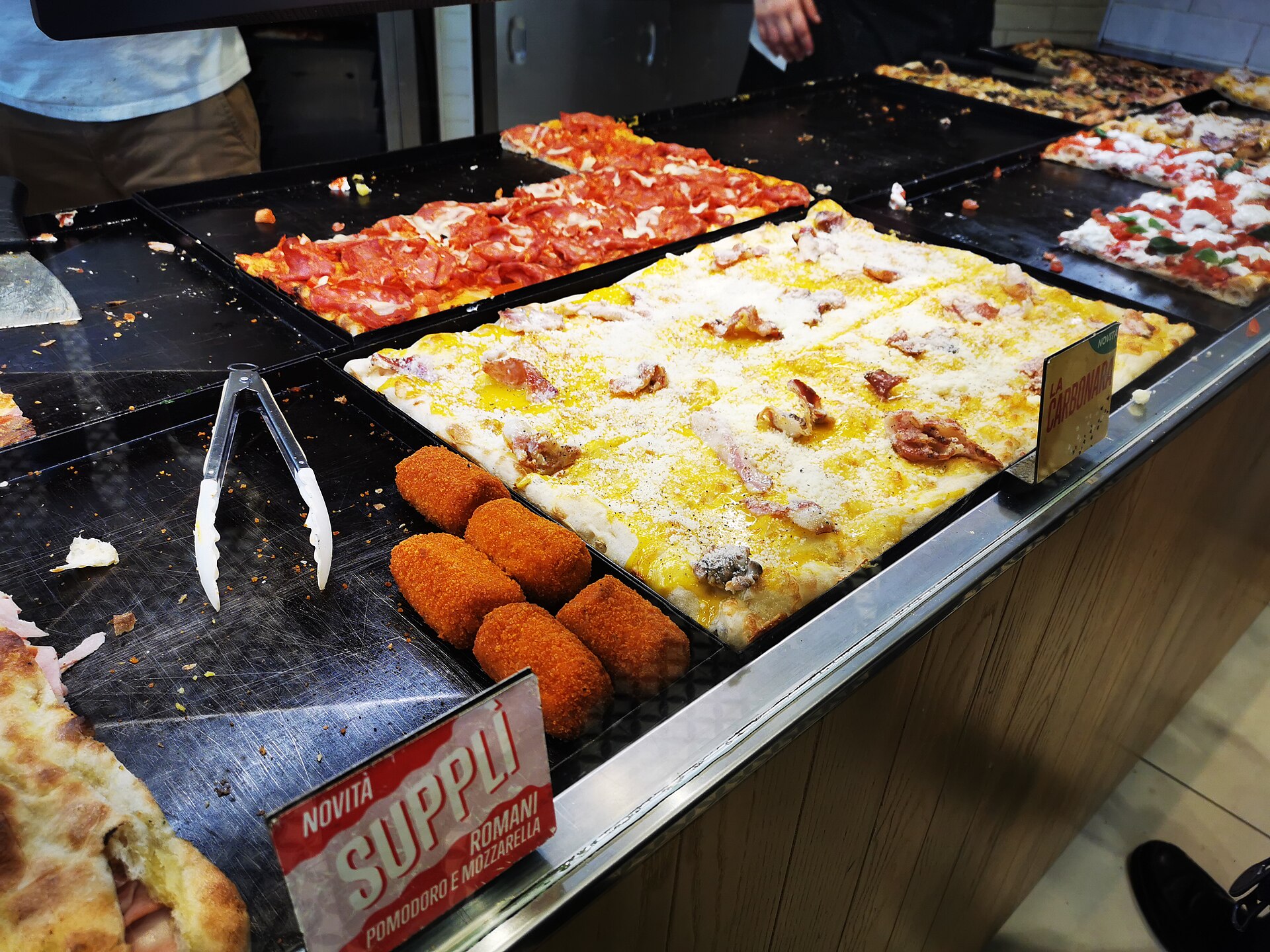 Supplì al telefono — Rome's essential street snack, deep-fried rice balls with mozzarella