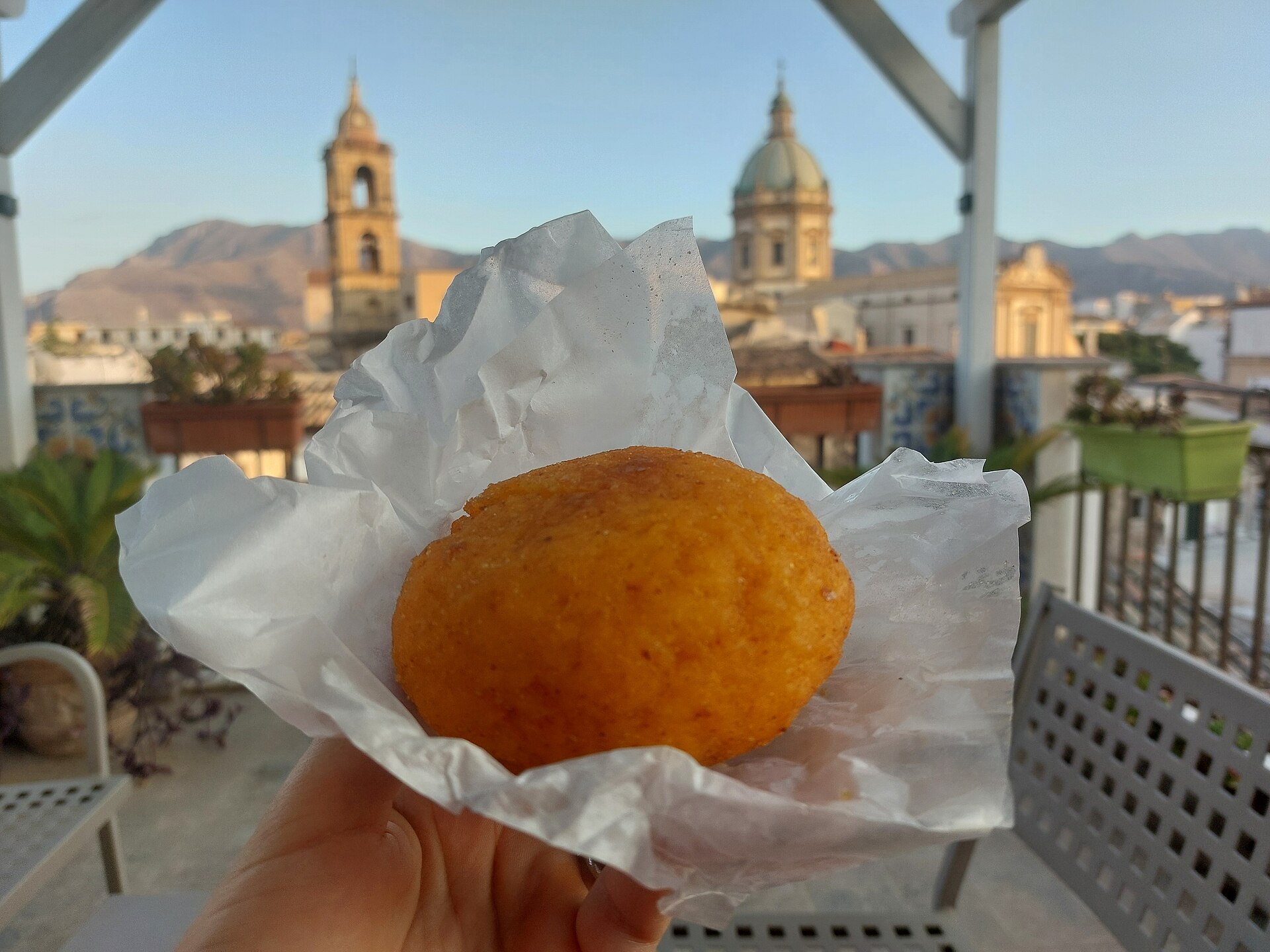 A platter of golden fried arancini rice balls, the signature dish opening this Sicily food guide