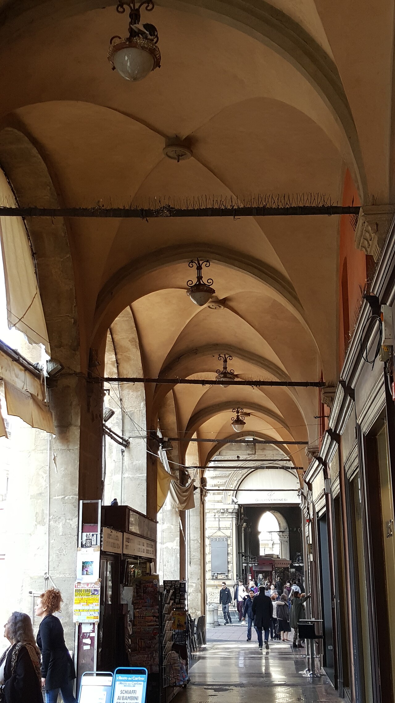 The famous porticoes of Bologna — miles of covered walkways that make solo exploration comfortable in any weather