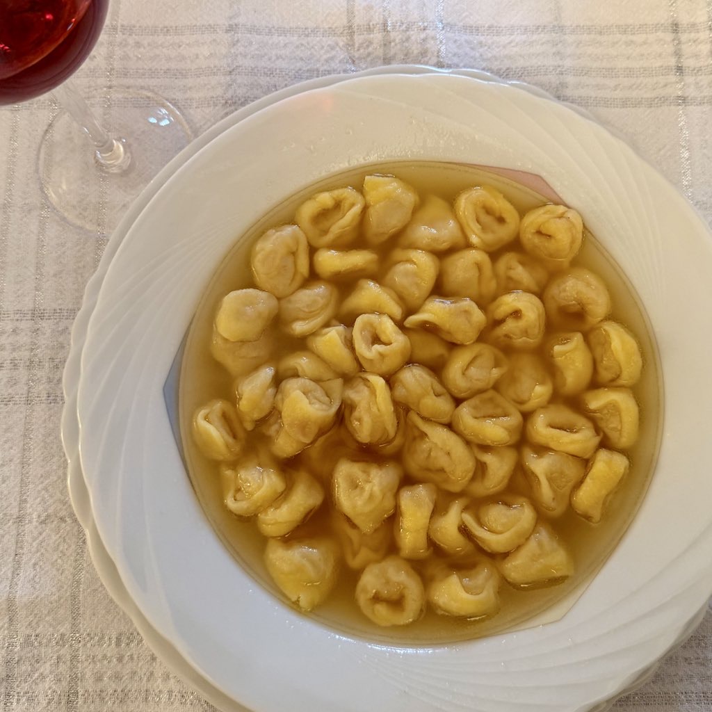 Tortellini in brodo, a signature Emilia-Romagna dish, served in clear capon broth