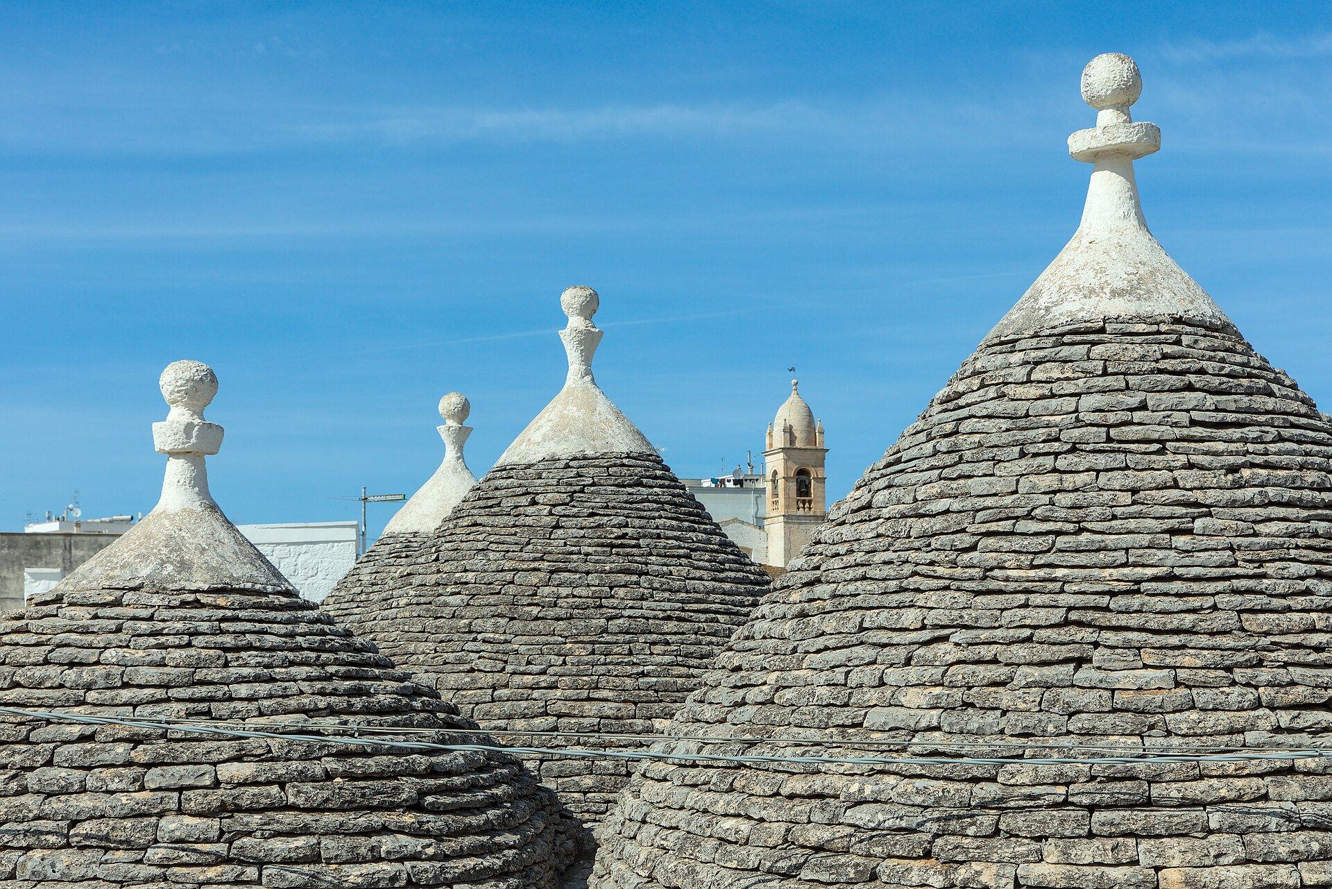 A street of conical-roofed trulli houses in Alberobello in Puglia's Valle d'Itria