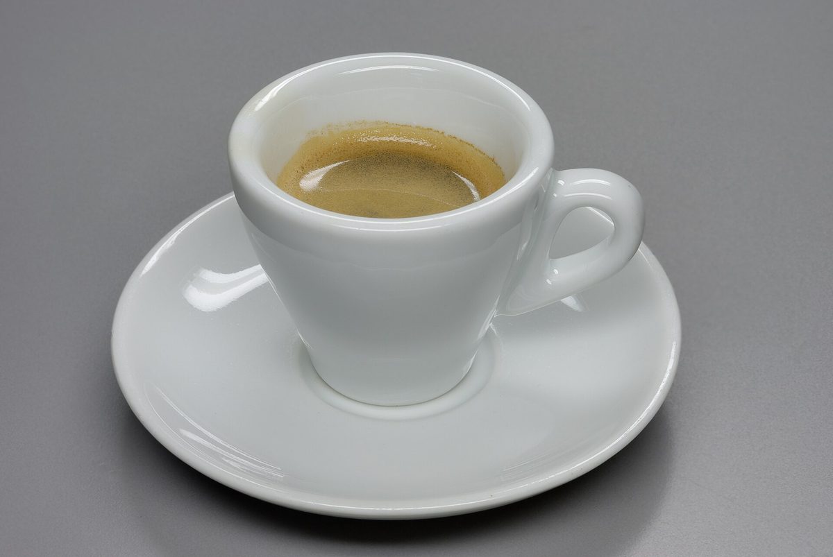 An espresso at the bar — standing coffee is part of everyday Italian etiquette