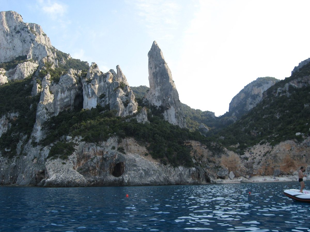 The limestone pinnacle and clear water of Cala Goloritze on Sardinia's east coast